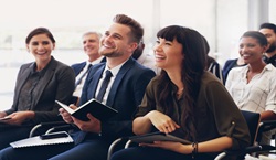 Adults laughing together in meeting