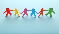 Colourful people made out of paper holding hands