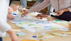 Team brainstorming on sheet of paper.jpeg
